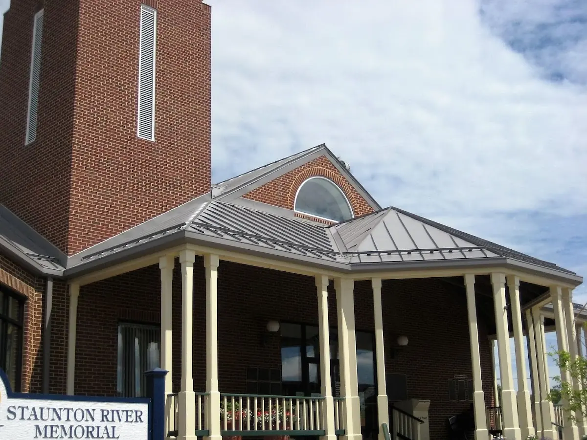 Skilled roofing craftsmen working on a residential roof in Sleepy Hollow